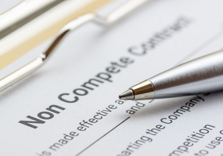 Blue,Pen,And,A,Non,Compete,Contract,On,A,Clipboard.